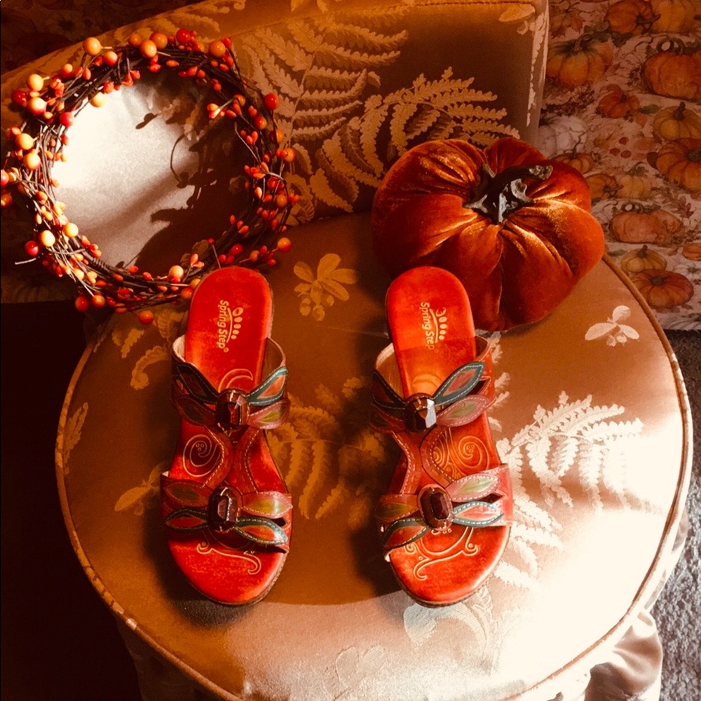 All leather shoes w/ a butterfly with a gem on top